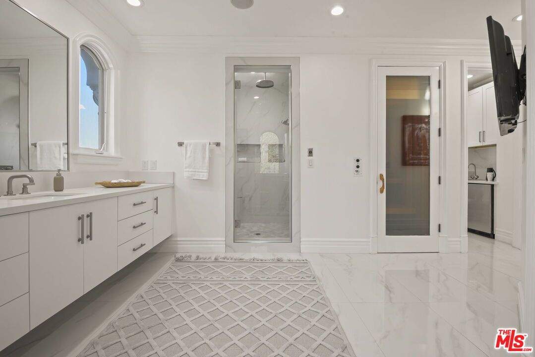 Bathroom, Dual Sink Vanities, Glass Shower, Interior, Marble, Marble Walls, Recessed Lighting