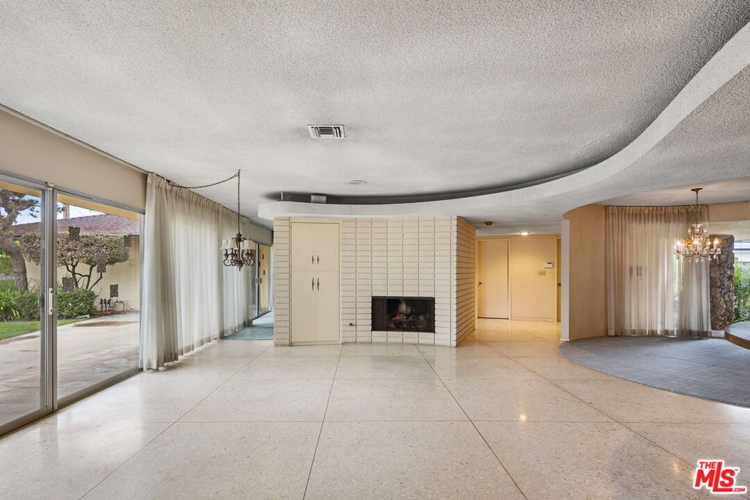 Chandelier, Empty room, Fireplace, Interior