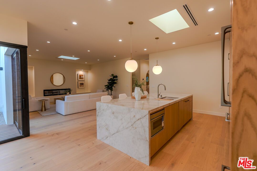 Dining room, Fireplace, Interior, Kitchen, Living room, Pendant Lights, Recessed Lighting, Wood Texture Flooring