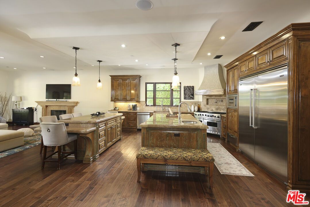 Fireplace, Interior, Kitchen, Living room, Pendant Lights, Recessed Lighting, Stainless Steel Appliances, Wood Texture Flooring