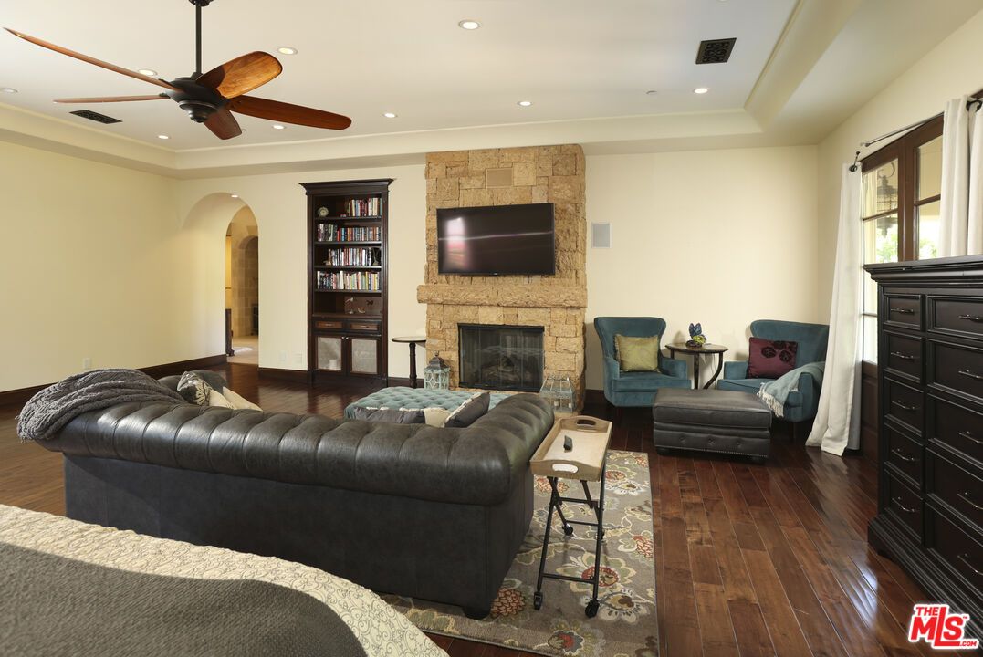 Fireplace, Interior, Living room, Recessed Lighting, Stone Walls, Wood Texture Flooring