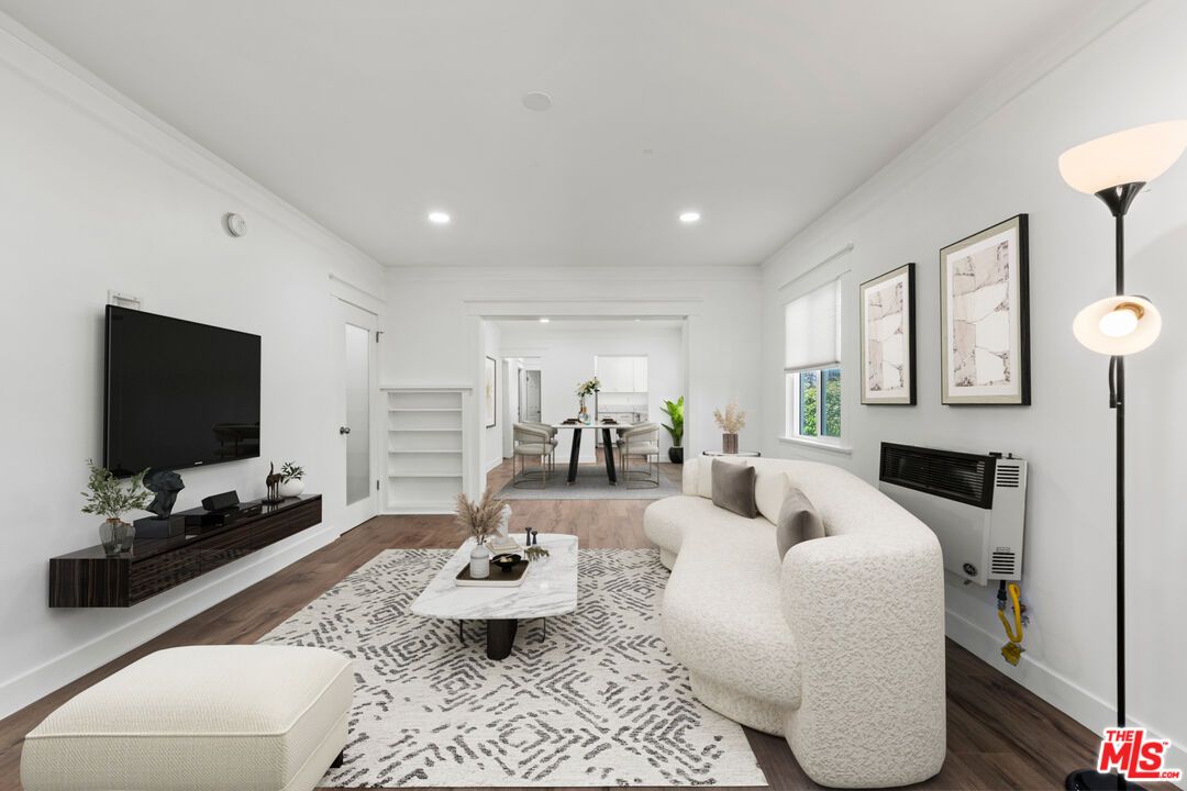 Dining room, Fireplace, Interior, Living room, Recessed Lighting, Wood Texture Flooring