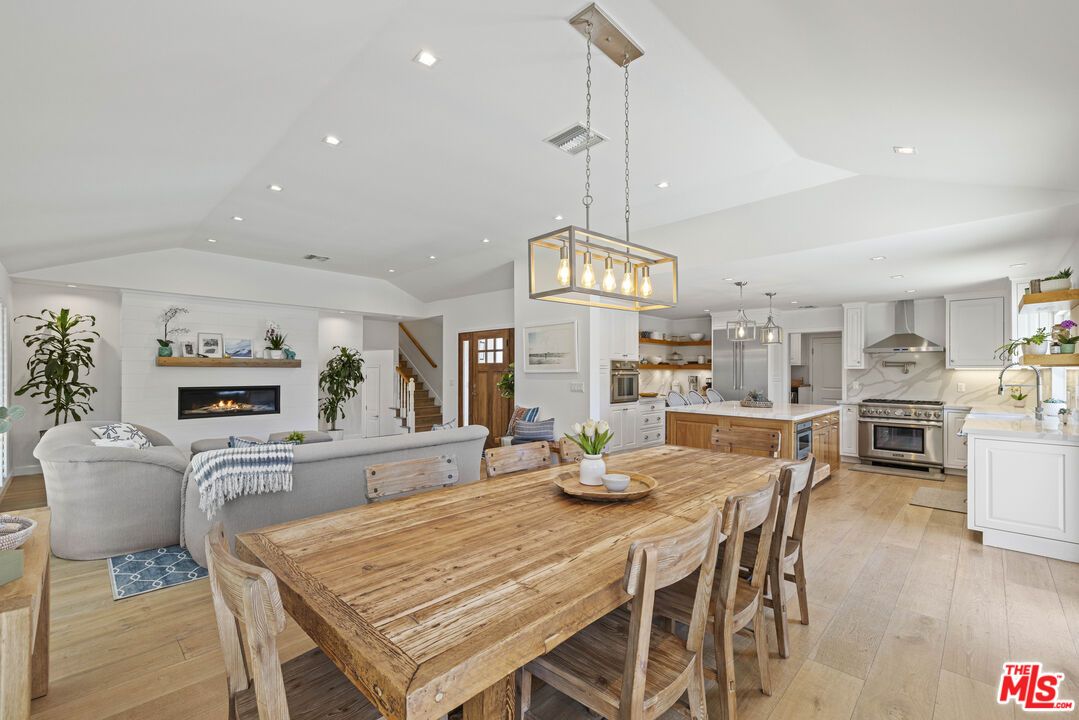 Dining room, Fireplace, Interior, Kitchen, Living room, Pendant Lights, Recessed Lighting, Stainless Steel Appliances, Wood Texture Flooring