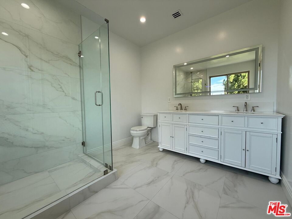 Bathroom, Dual Sink Vanities, Glass Shower, Interior, Marble, Marble Walls, Recessed Lighting