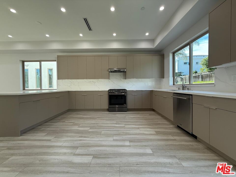 Interior, Kitchen, Marble Walls, Recessed Lighting, Stainless Steel Appliances, Wood Texture Flooring