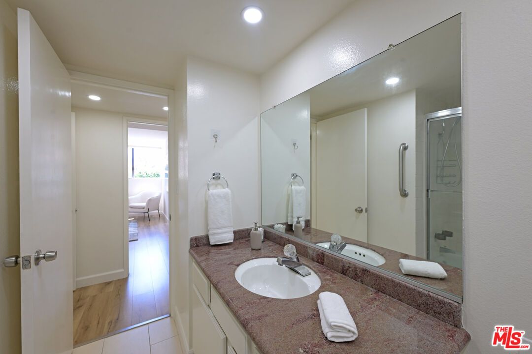 Bathroom, Dual Sink Vanities, Glass Shower, Interior, Recessed Lighting, Wood Texture Flooring