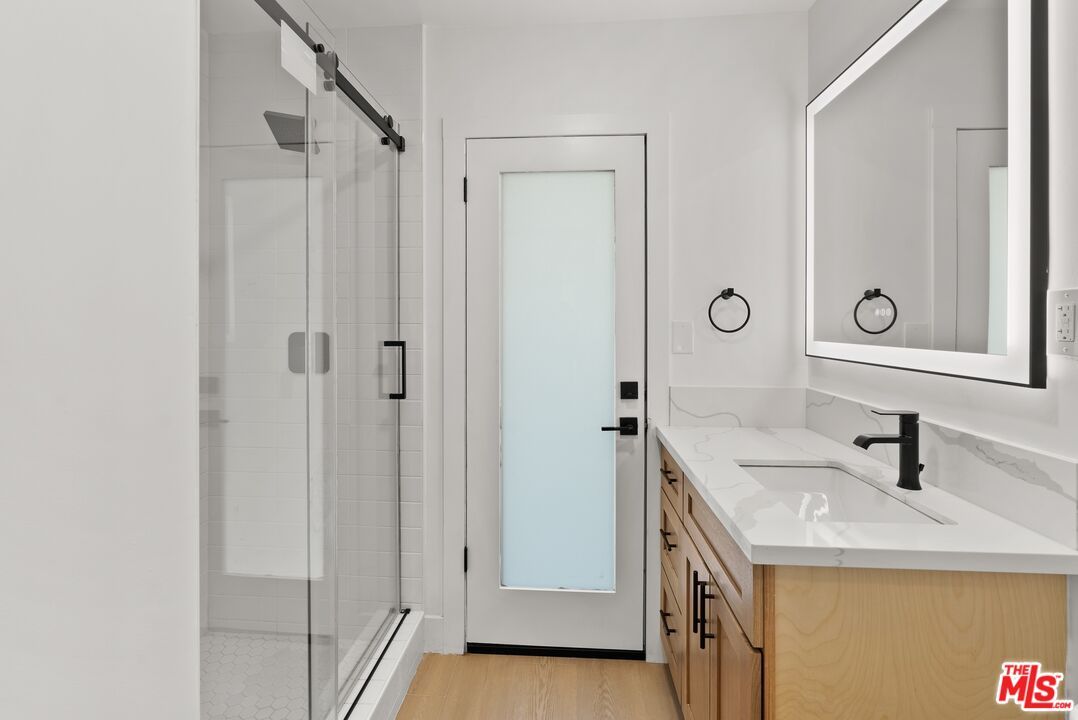 Bathroom, Dual Sink Vanities, Glass Shower, Interior, Wood Texture Flooring