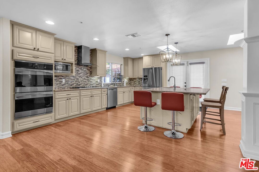 Chandelier, Interior, Kitchen, Pendant Lights, Recessed Lighting, Stainless Steel Appliances, Wood Texture Flooring