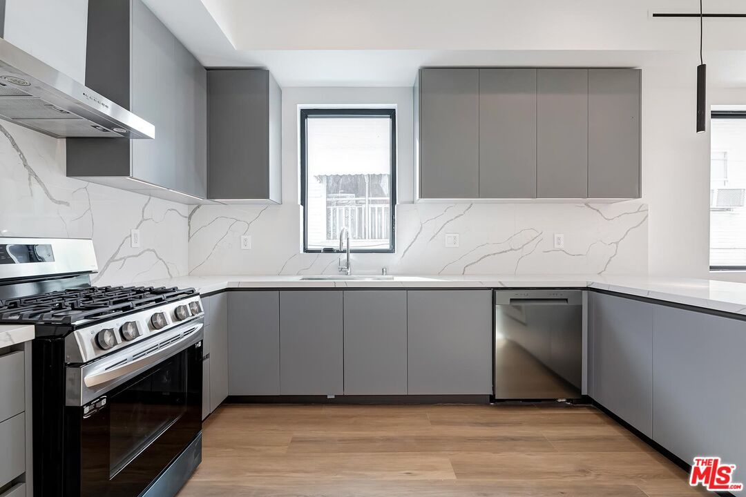 Interior, Kitchen, Marble Walls, Stainless Steel Appliances, Wood Texture Flooring