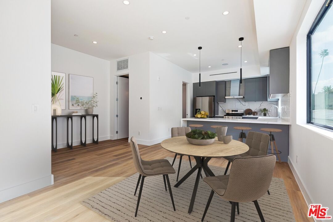 Dining room, Interior, Kitchen, Pendant Lights, Recessed Lighting, Stainless Steel Appliances, Wood Texture Flooring