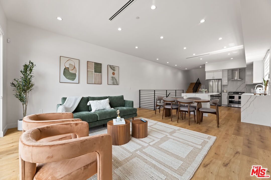 Dining room, Interior, Kitchen, Living room, Recessed Lighting, Stainless Steel Appliances, Wood Texture Flooring