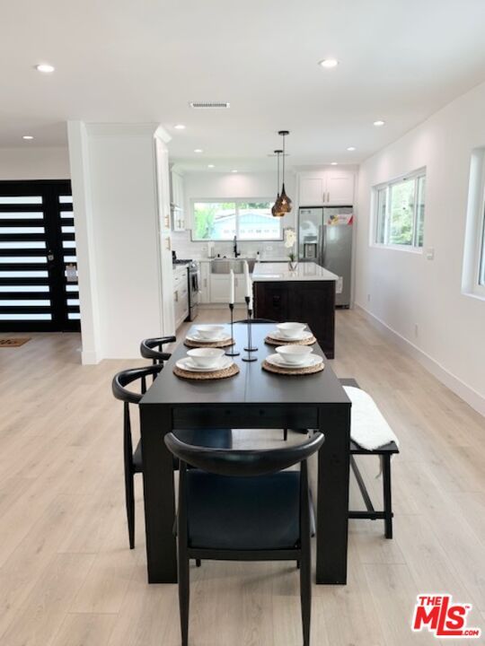 Dining room, Interior, Kitchen, Pendant Lights, Recessed Lighting, Stainless Steel Appliances, Wood Texture Flooring