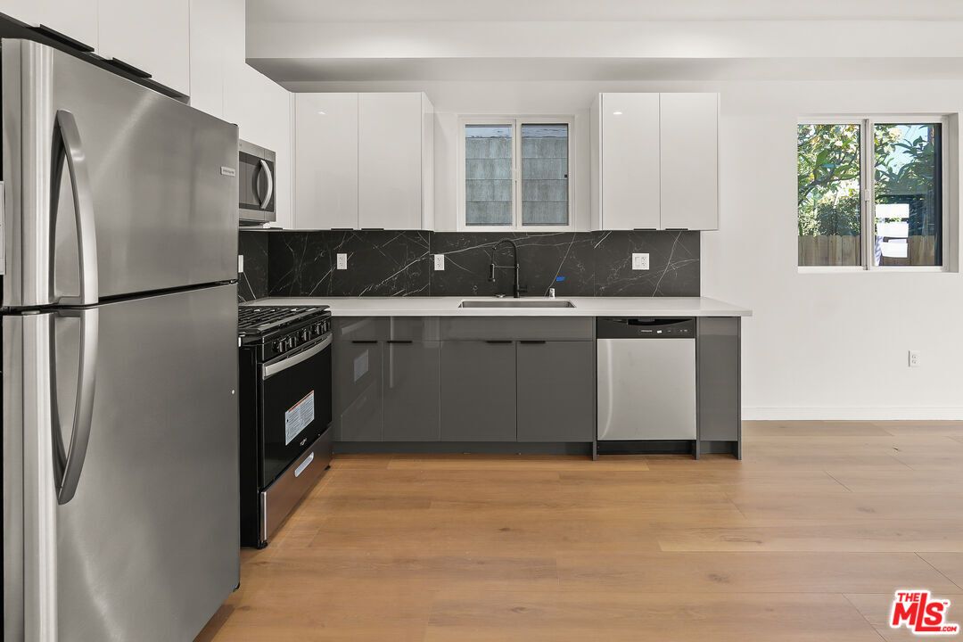 Interior, Kitchen, Marble Walls, Stainless Steel Appliances, Wood Texture Flooring