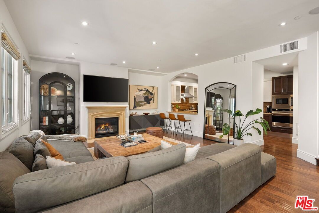 Dining room, Fireplace, Interior, Kitchen, Living room, Recessed Lighting, Wood Texture Flooring