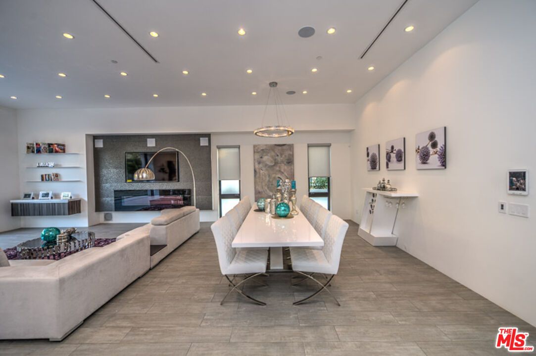 Dining room, Fireplace, Interior, Living room, Pendant Lights, Recessed Lighting, Wood Texture Flooring