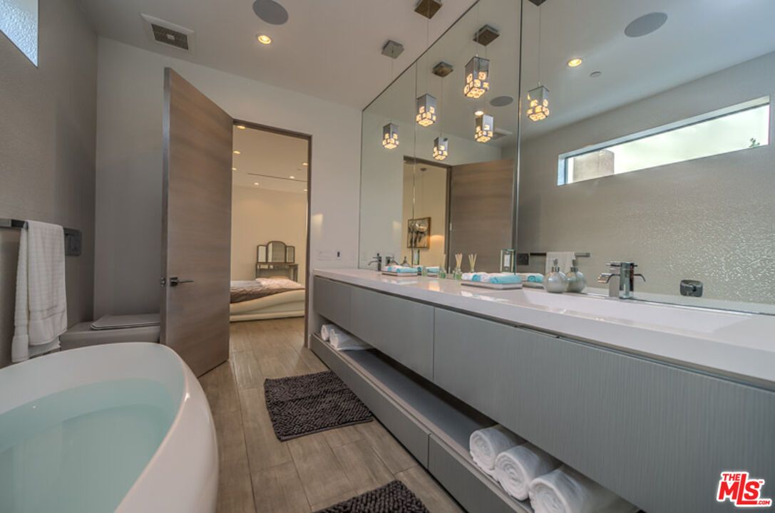 Bathroom, Dual Sink Vanities, Free Standing Baths, Interior, Pendant Lights, Recessed Lighting, Wood Texture Flooring