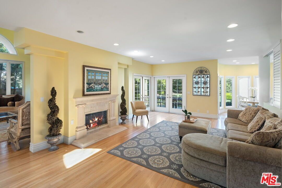 Dining room, Fireplace, Interior, Living room, Recessed Lighting, Wood Texture Flooring