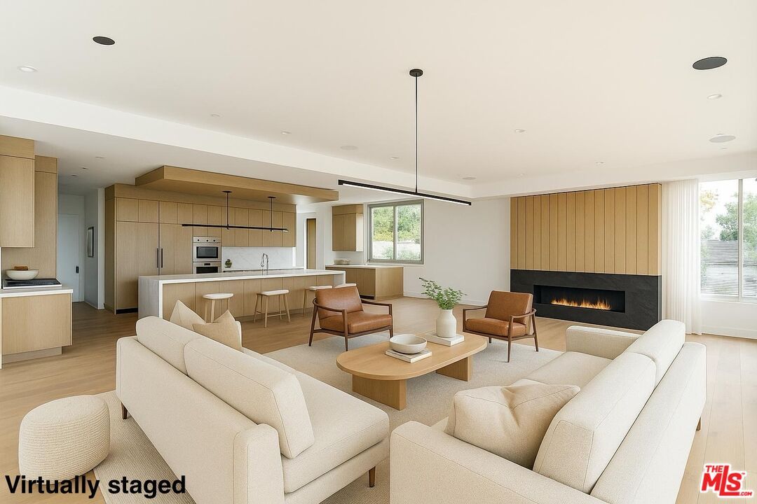 Fireplace, Interior, Kitchen, Living room, Pendant Lights, Recessed Lighting, Stainless Steel Appliances, Wood Texture Flooring