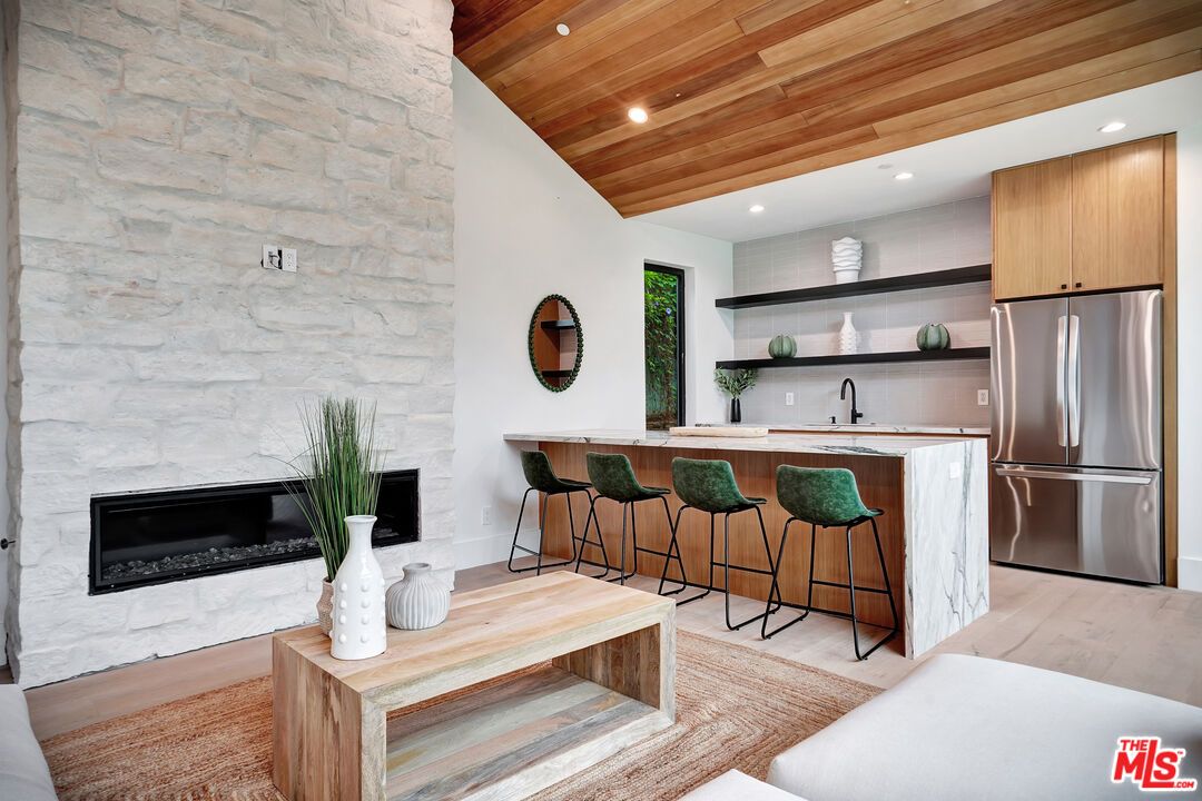 Fireplace, Interior, Kitchen, Recessed Lighting, Stainless Steel Appliances, Stone Walls, Wooden Ceilings, Wood Texture Flooring