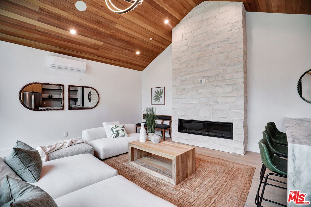 Fireplace, Interior, Living room, Recessed Lighting, Stone Walls, Wooden Ceilings, Wood Texture Flooring