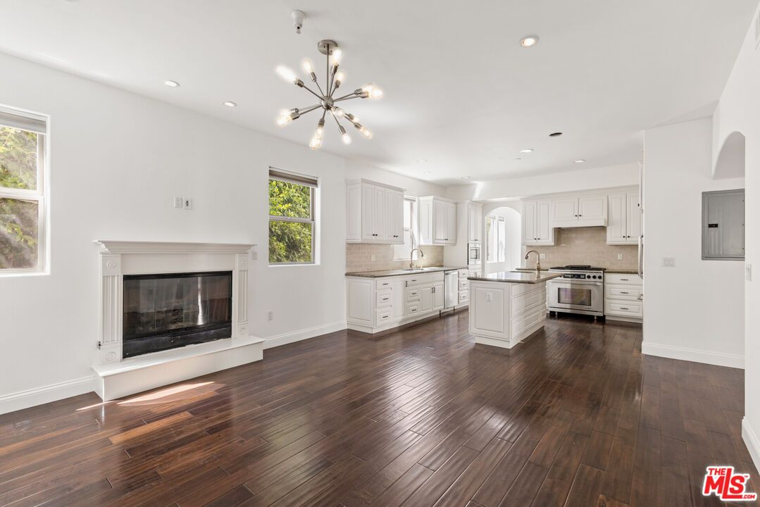 Fireplace, Interior, Kitchen, Pendant Lights, Recessed Lighting, Stainless Steel Appliances, Wood Texture Flooring