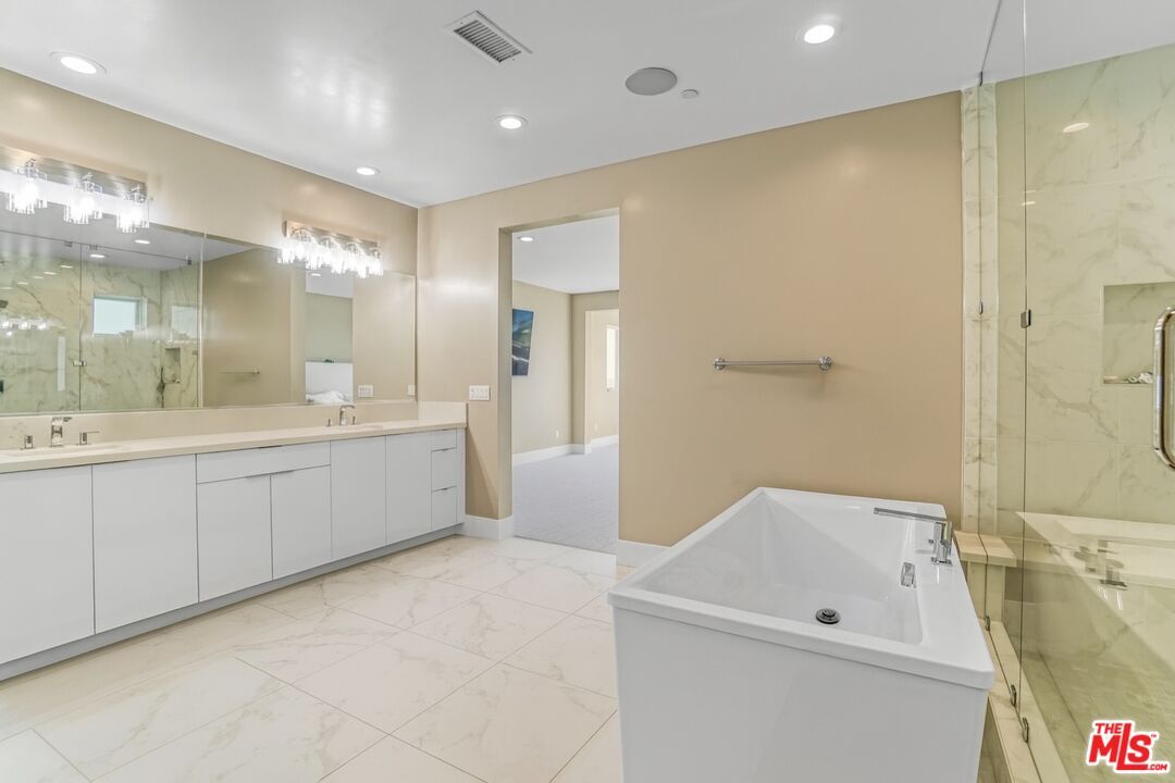Bathroom, Dual Sink Vanities, Glass Shower, Interior, Marble, Marble Walls, Recessed Lighting