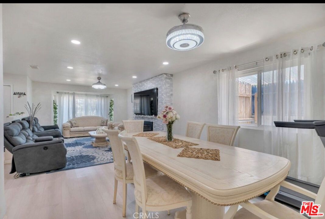 Dining room, Fireplace, Interior, Living room, Recessed Lighting, Wood Texture Flooring