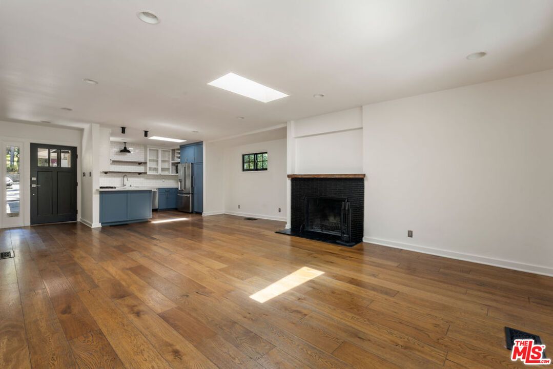 Empty room, Fireplace, Interior, Kitchen, Recessed Lighting, Wood Texture Flooring