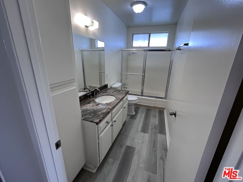 Bathroom, Dual Sink Vanities, Glass Shower, Interior, Wood Texture Flooring