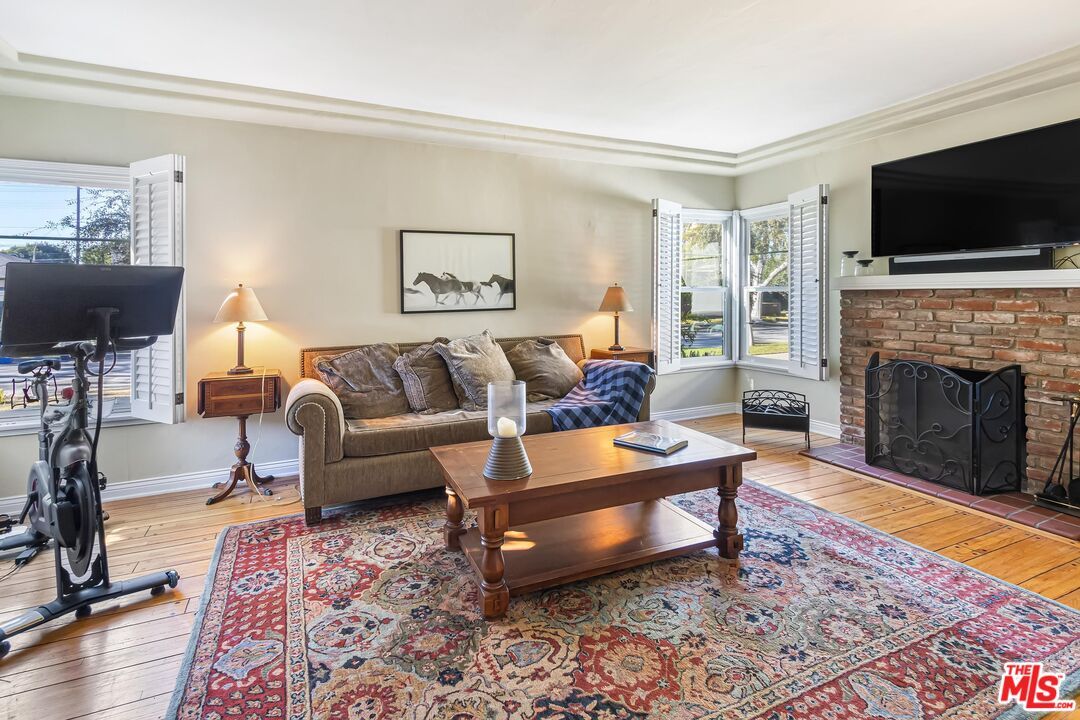 Fireplace, Fitness Equipment, Interior, Living room, Stone Walls, Wood Texture Flooring