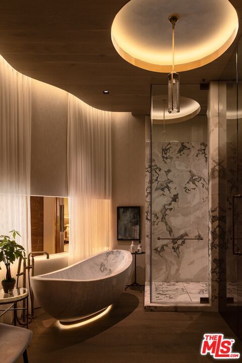 Bathroom, Free Standing Baths, Interior, Marble Walls, Pendant Lights, Recessed Lighting, Wood Texture Flooring