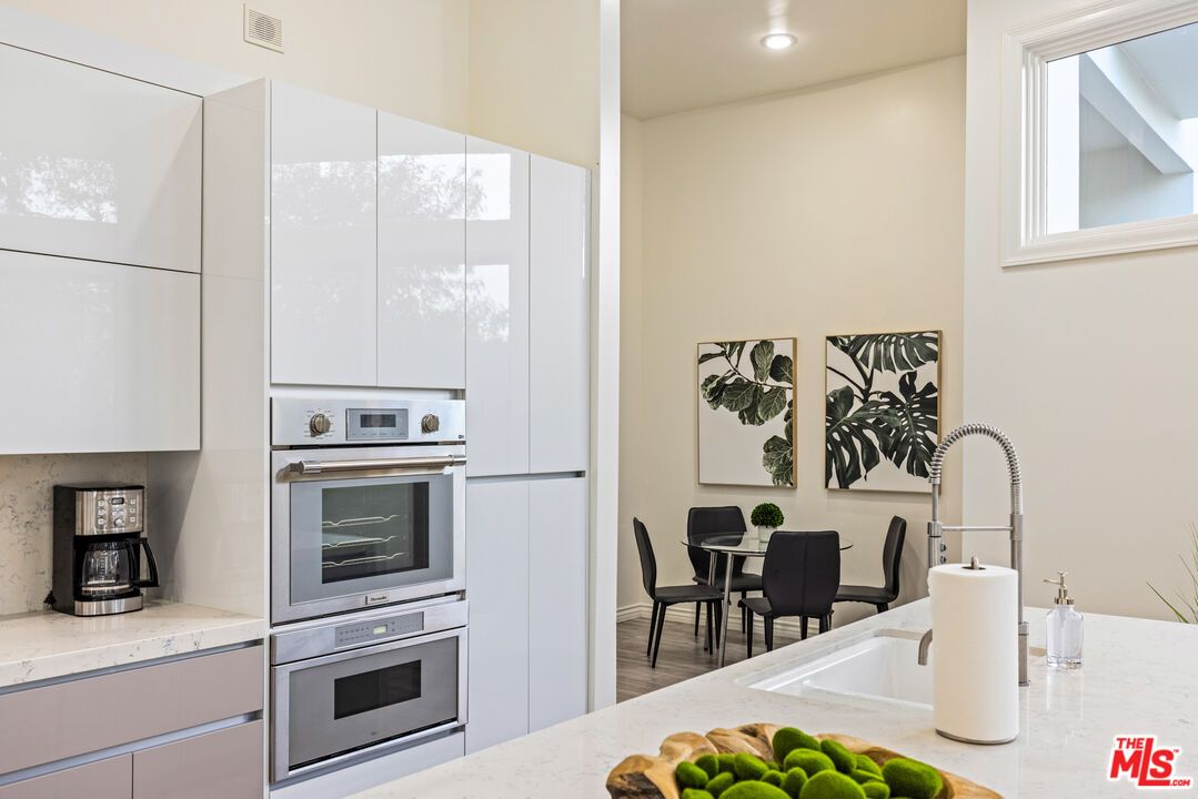 Dining room, Interior, Kitchen, Recessed Lighting, Stainless Steel Appliances, Wood Texture Flooring
