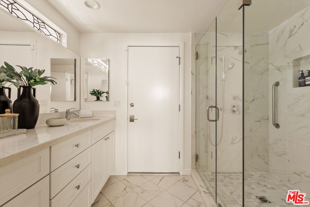 Bathroom, Dual Sink Vanities, Glass Shower, Interior, Marble, Marble Walls, Recessed Lighting