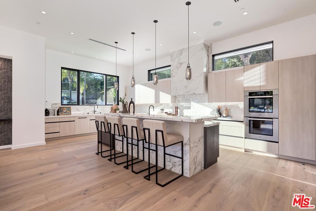 Interior, Kitchen, Marble Walls, Pendant Lights, Recessed Lighting, Stainless Steel Appliances, Wood Texture Flooring