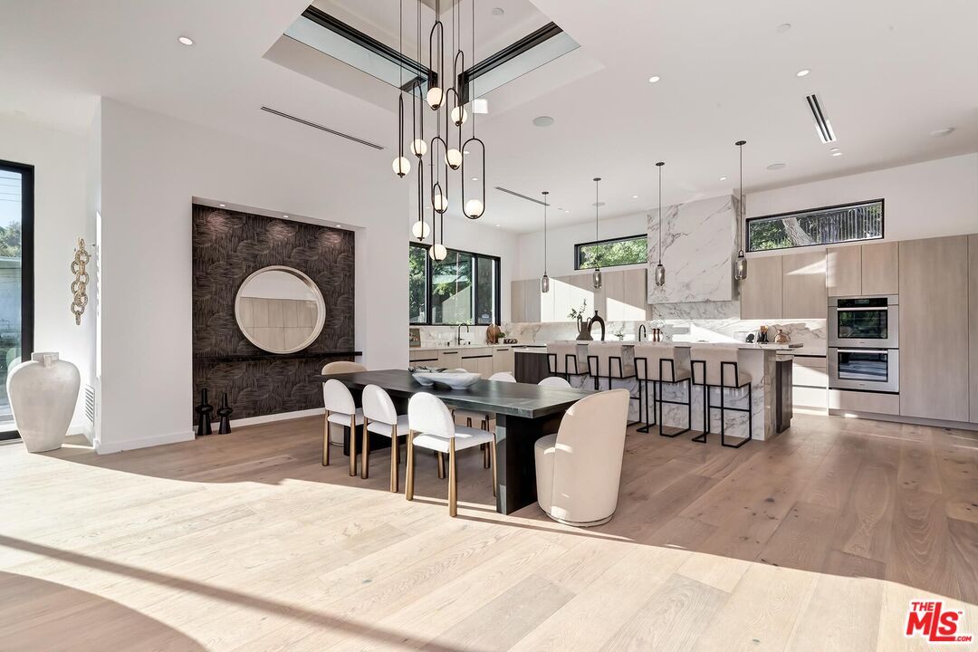 Dining room, Interior, Kitchen, Marble Walls, Pendant Lights, Recessed Lighting, Stainless Steel Appliances, Wood Texture Flooring