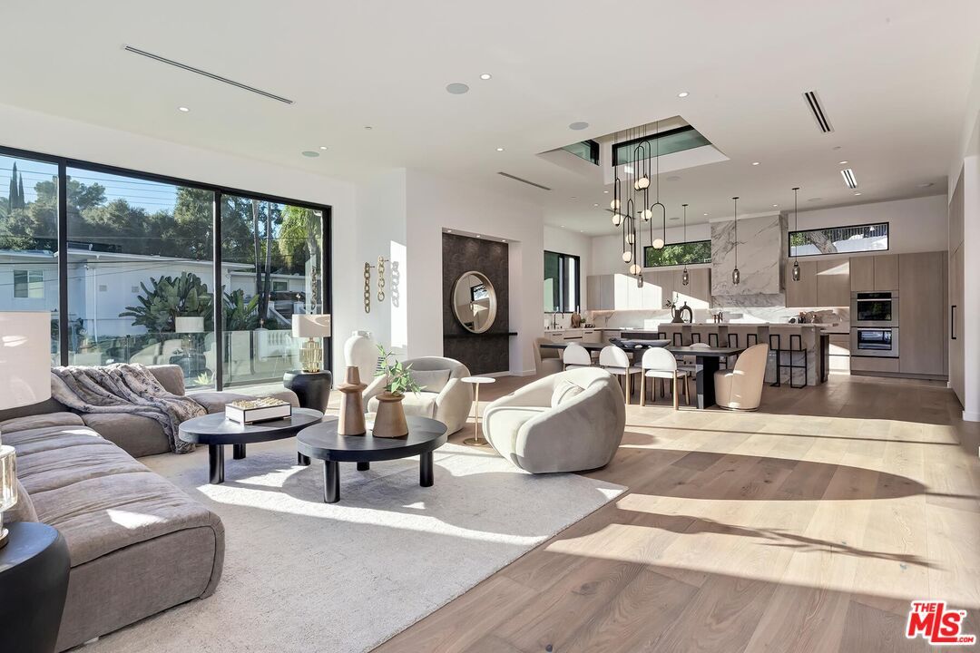 Dining room, Interior, Kitchen, Living room, Pendant Lights, Recessed Lighting, Stainless Steel Appliances, Wood Texture Flooring