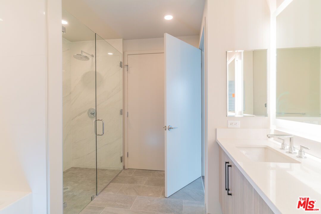Bathroom, Dual Sink Vanities, Glass Shower, Interior, Marble Walls, Recessed Lighting