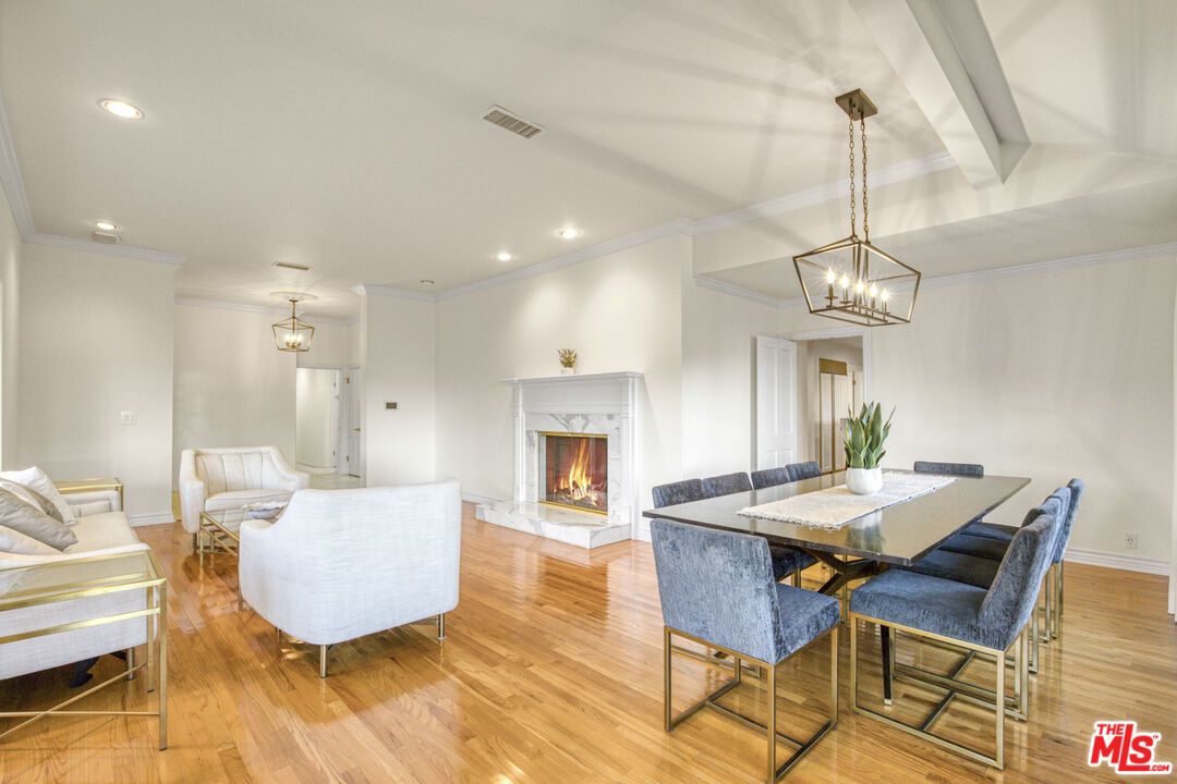 Dining room, Fireplace, Interior, Living room, Pendant Lights, Recessed Lighting, Wood Texture Flooring
