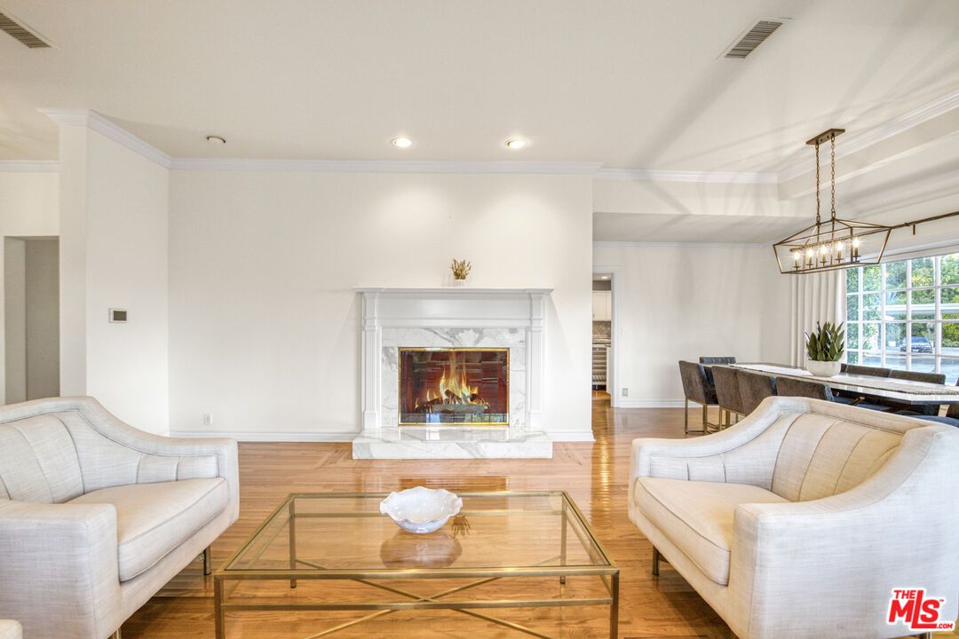 Dining room, Fireplace, Interior, Living room, Pendant Lights, Recessed Lighting, Wood Texture Flooring