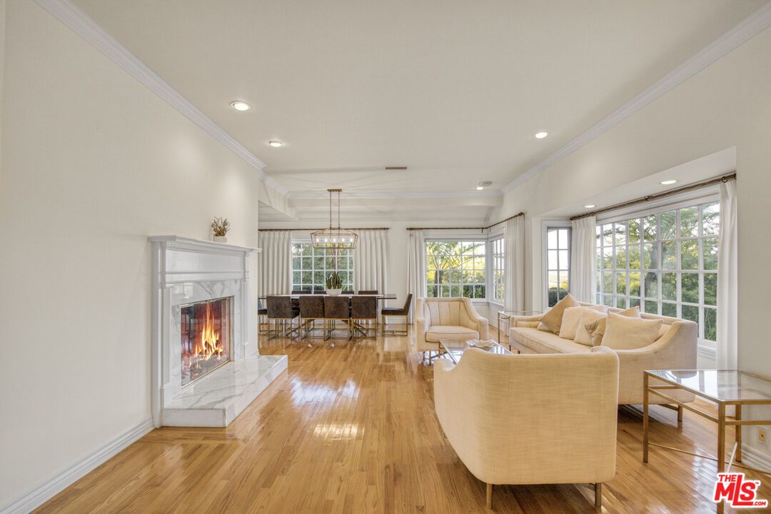Chandelier, Dining room, Fireplace, Interior, Living room, Pendant Lights, Recessed Lighting, Wood Texture Flooring