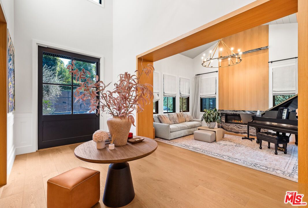 Chandelier, Fireplace, Interior, Living room, Piano, Wood Texture Flooring