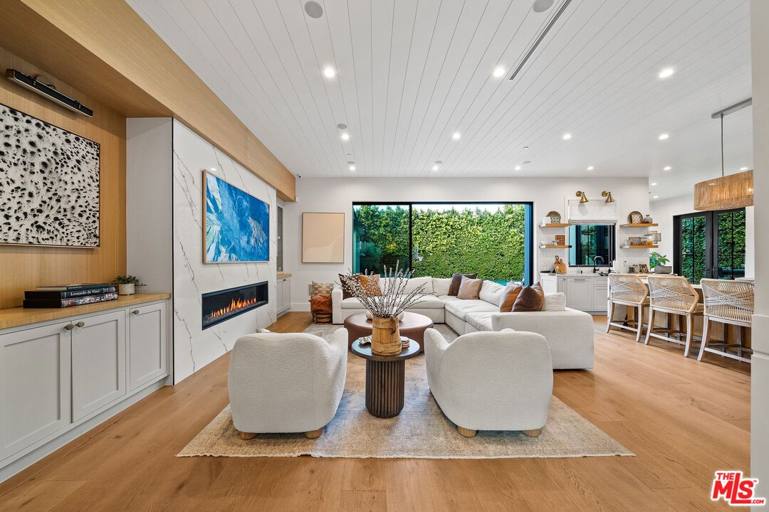 Dining room, Fireplace, Interior, Living room, Pendant Lights, Recessed Lighting, Wood Texture Flooring