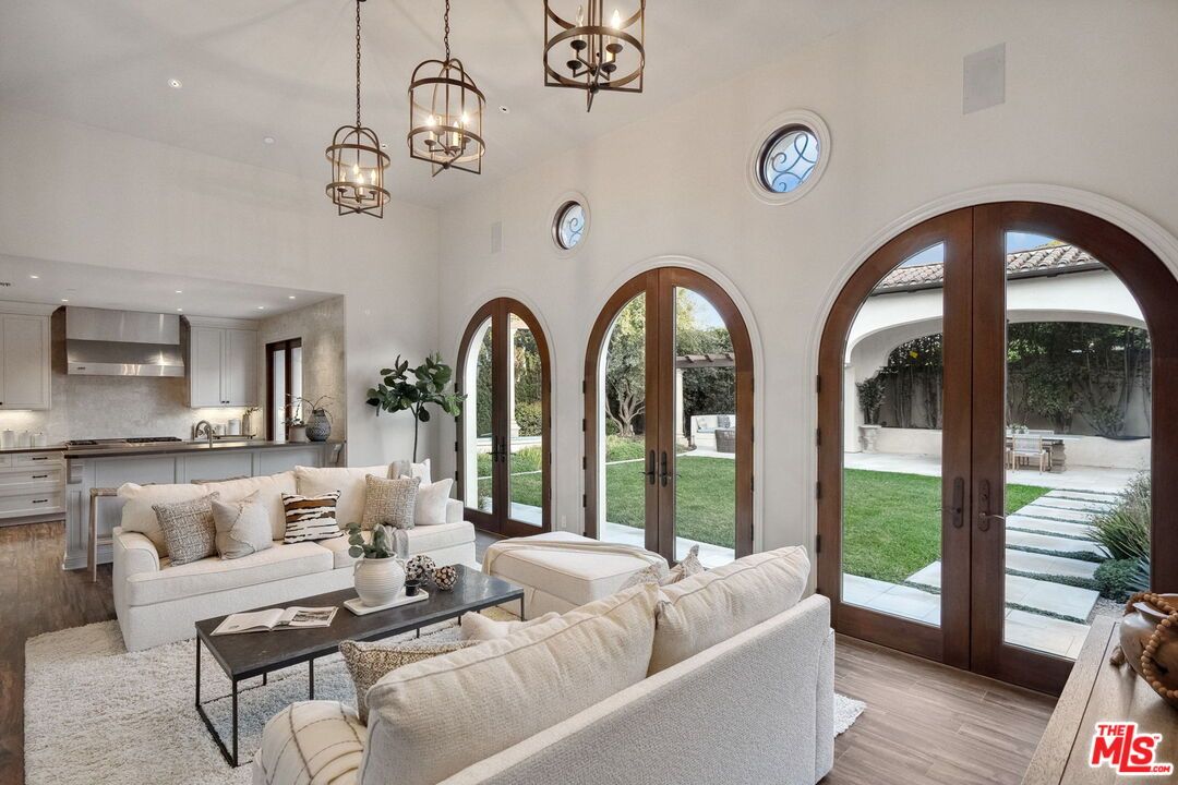 Chandelier, Interior, Kitchen, Living room, Pendant Lights, Recessed Lighting, Stainless Steel Appliances, Wood Texture Flooring