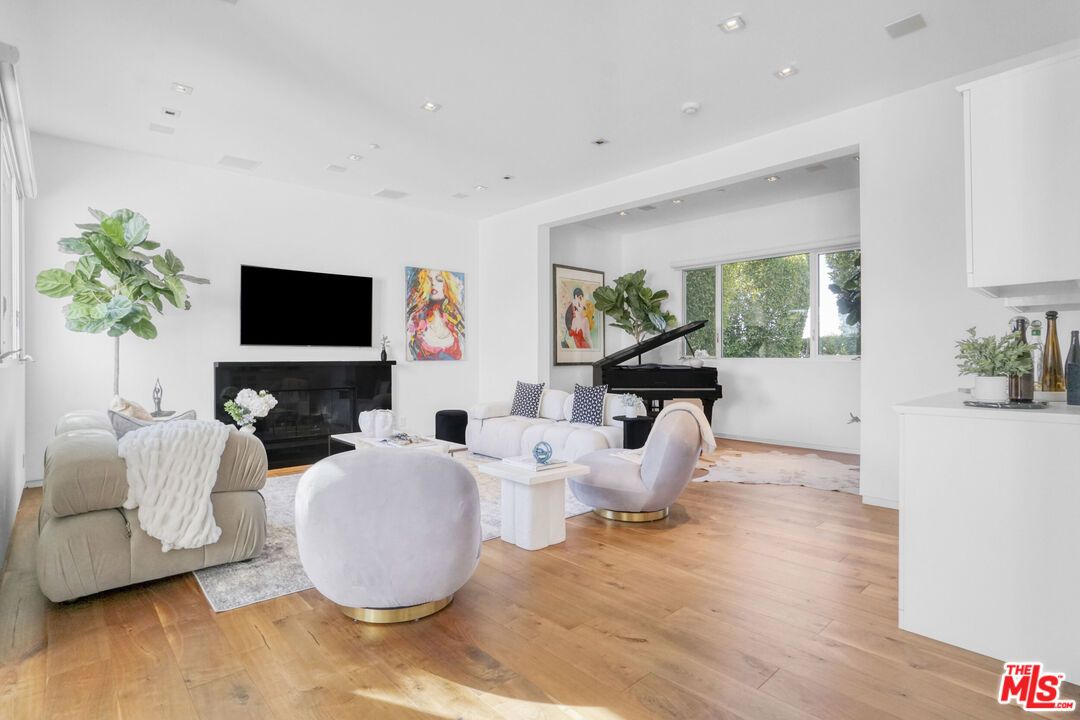 Fireplace, Interior, Living room, Piano, Recessed Lighting, Wood Texture Flooring