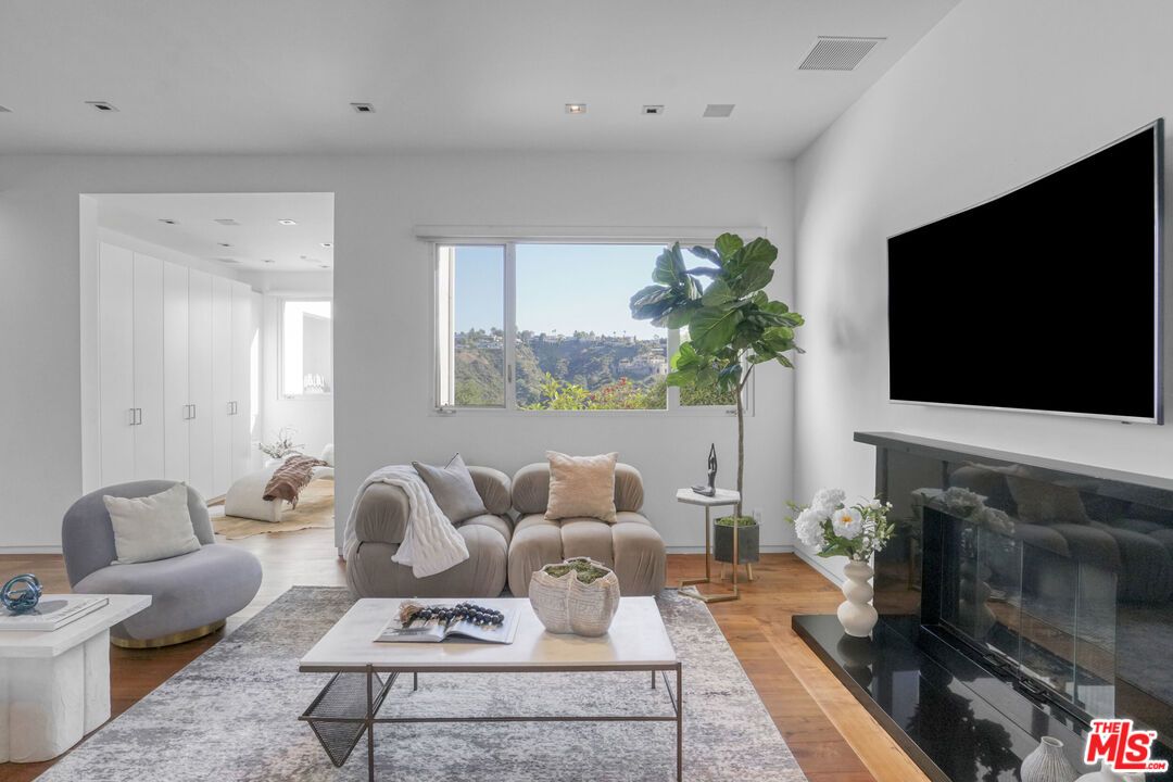 Fireplace, Interior, Living room, Recessed Lighting, Wood Texture Flooring