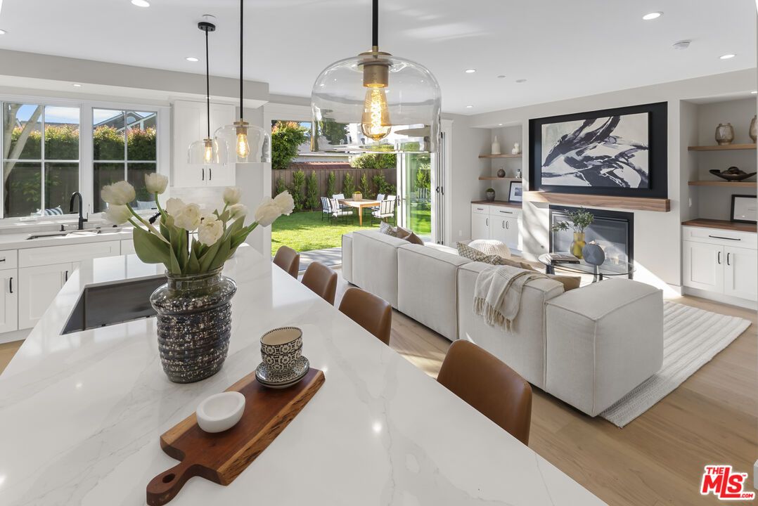 Dining room, Fireplace, Interior, Living room, Pendant Lights, Recessed Lighting, Wood Texture Flooring