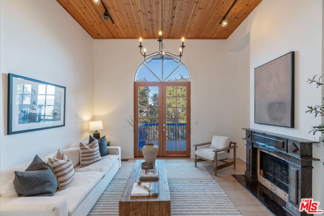 Chandelier, Fireplace, Interior, Living room, Recessed Lighting, Wooden Ceilings, Wood Texture Flooring