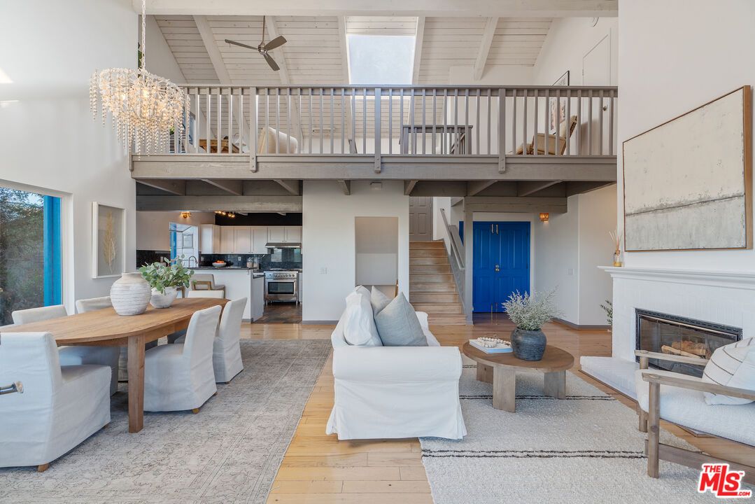 Chandelier, Dining room, Fireplace, Interior, Kitchen, Living room, Stainless Steel Appliances, Wood Texture Flooring