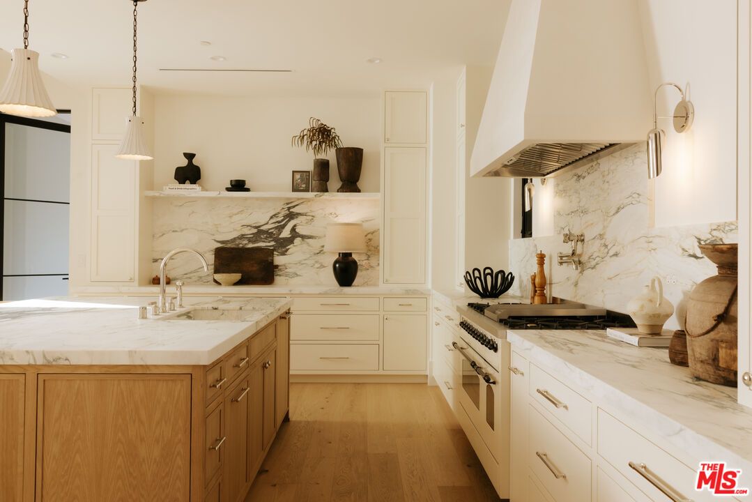 Interior, Kitchen, Marble Walls, Pendant Lights, Recessed Lighting, Stainless Steel Appliances, Wood Texture Flooring