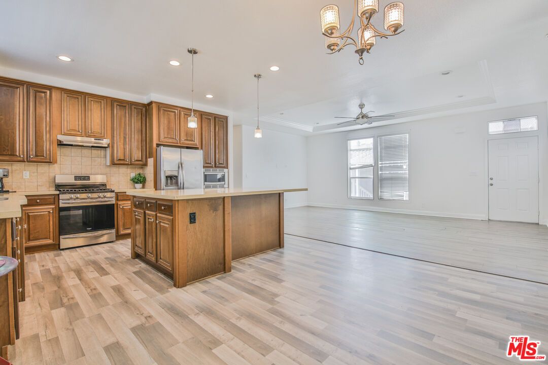 Chandelier, Interior, Kitchen, Pendant Lights, Recessed Lighting, Stainless Steel Appliances, Wood Texture Flooring